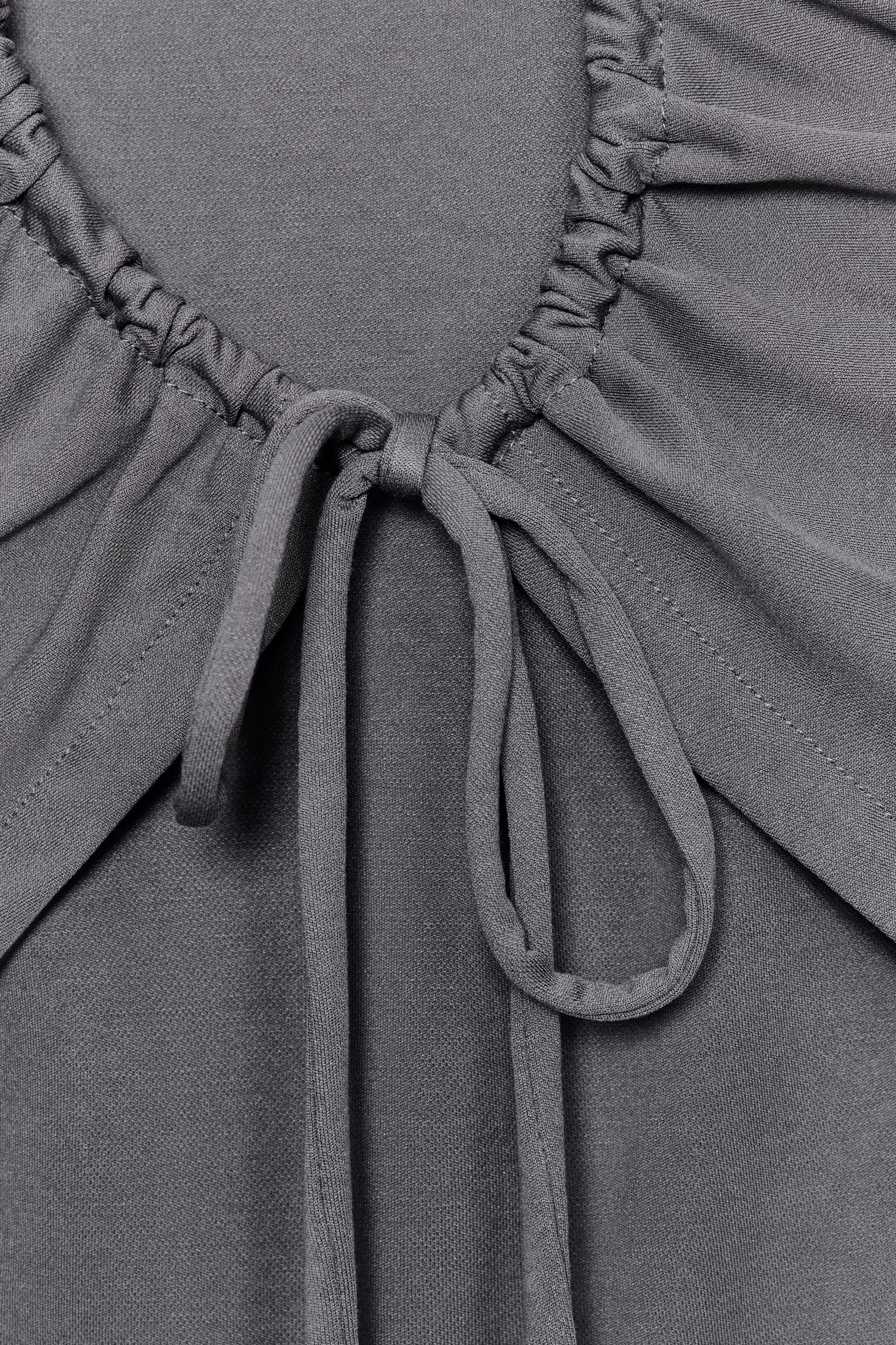 FLOWY TOP WITH BACK OPENING